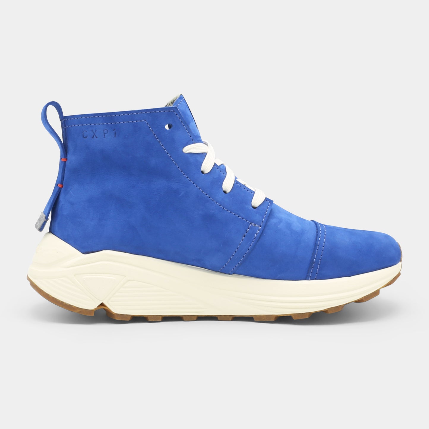 A blue high-top urban utility chukka boot with white laces and a chunky white sole medial view.