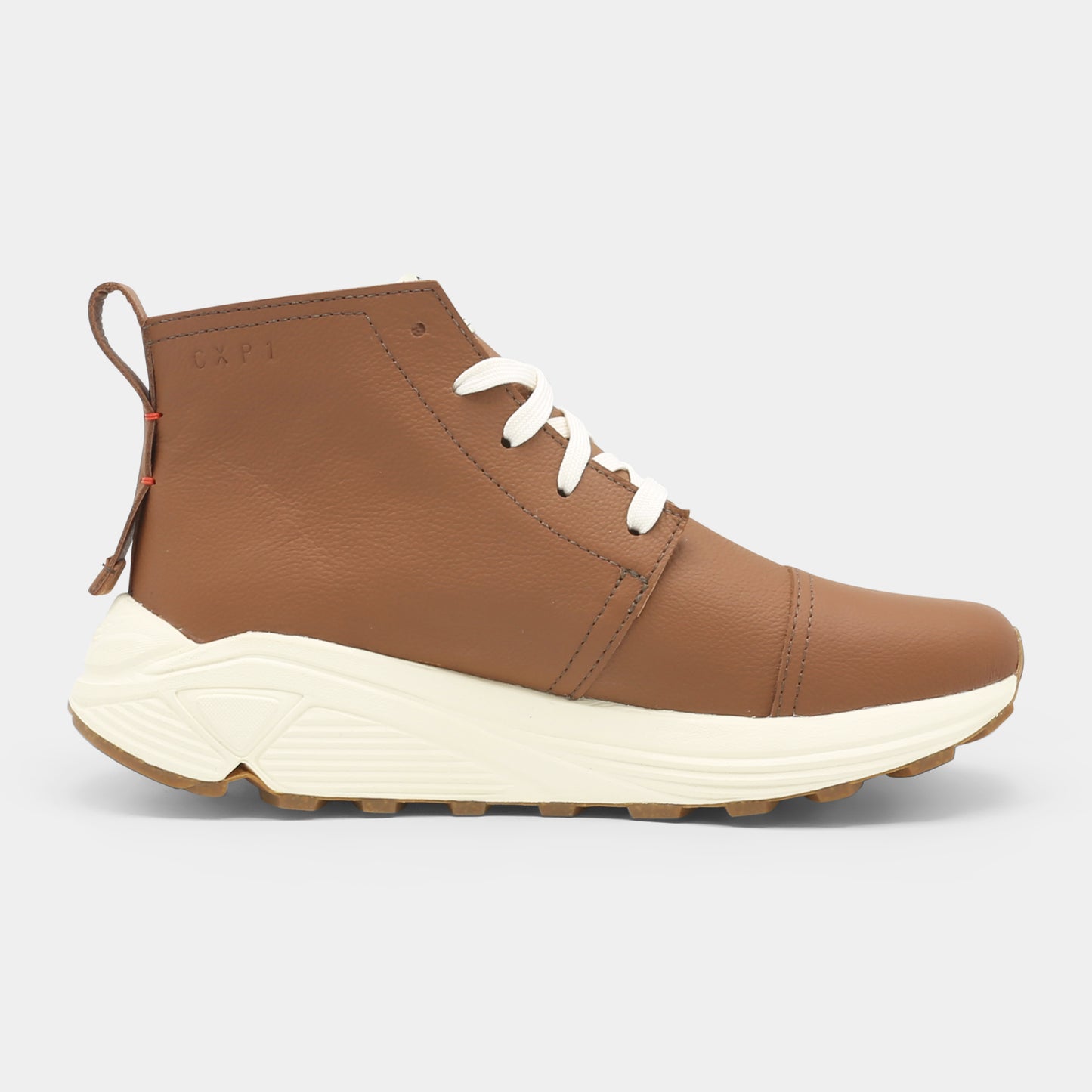 A brown high-top urban utility chukka boot with white laces and a chunky white sole medial view.