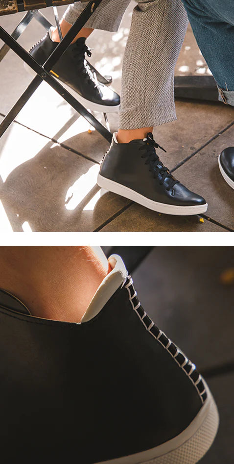 black hand stitched backing on black leather shoe