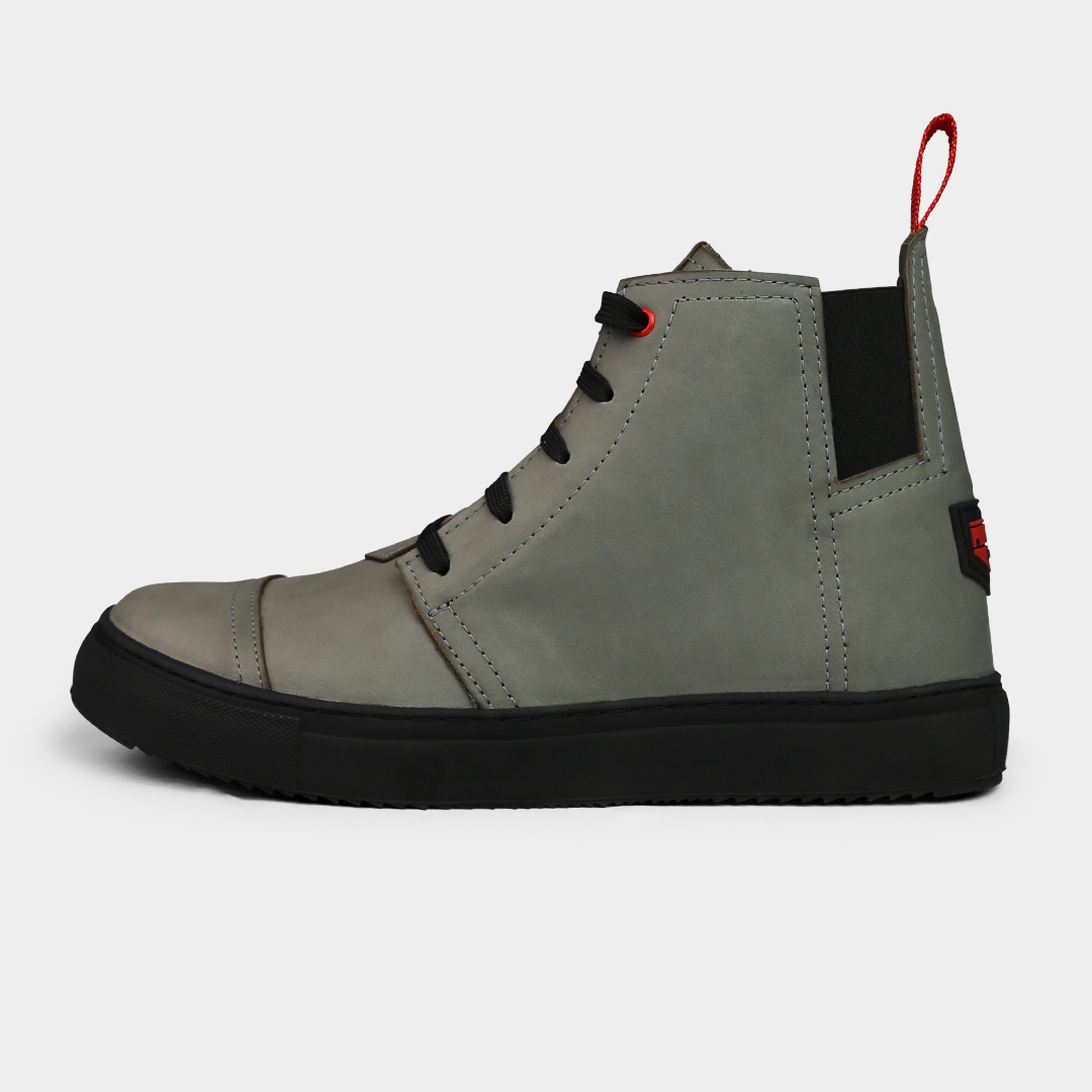 The Mayor from ComunityMade with Pingree Detroit, side shot. The shoe is grey with a black sole and black lace closure.