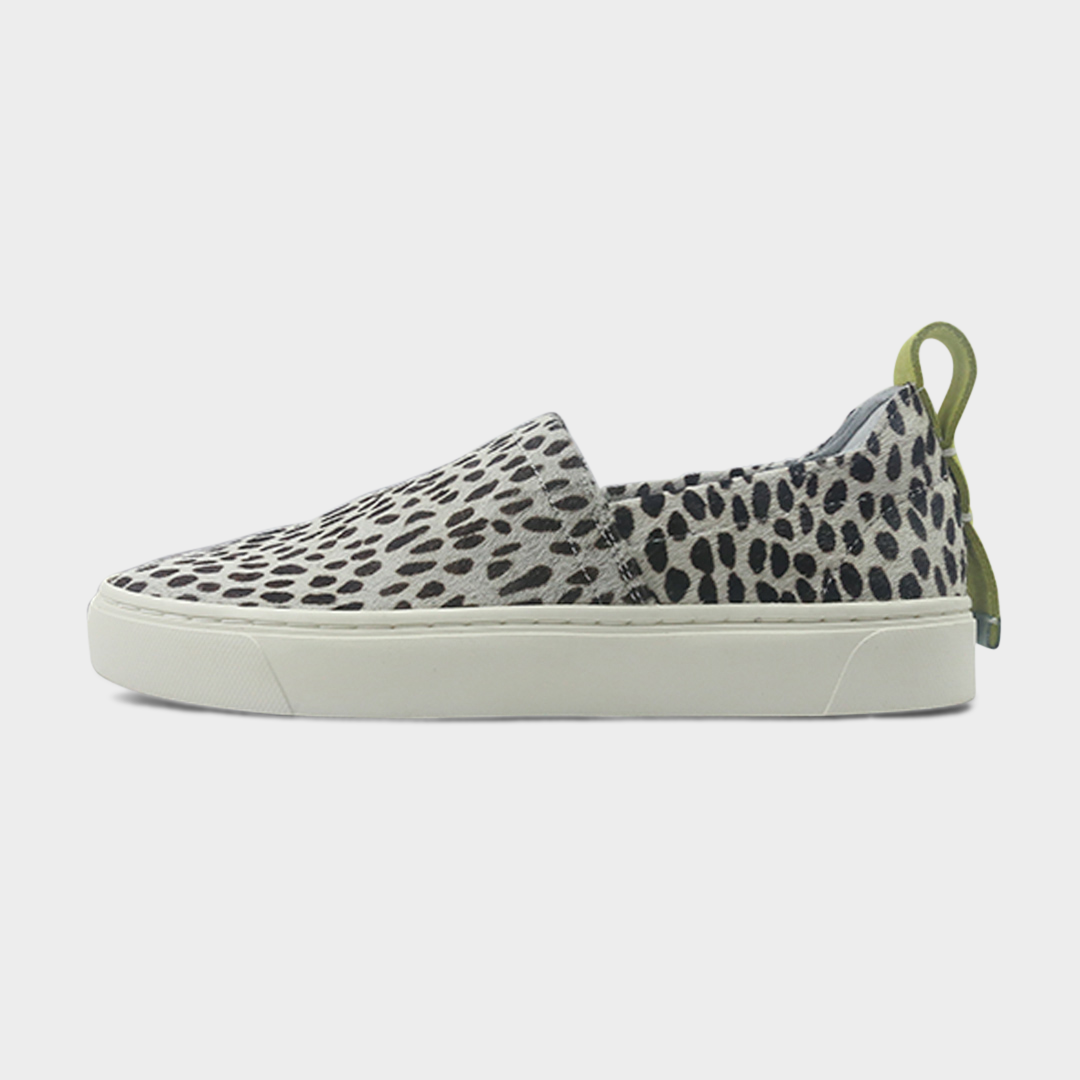 A cheetah slip-on women's shoe with a suede and manmade material upper and a rubber sole lateral view