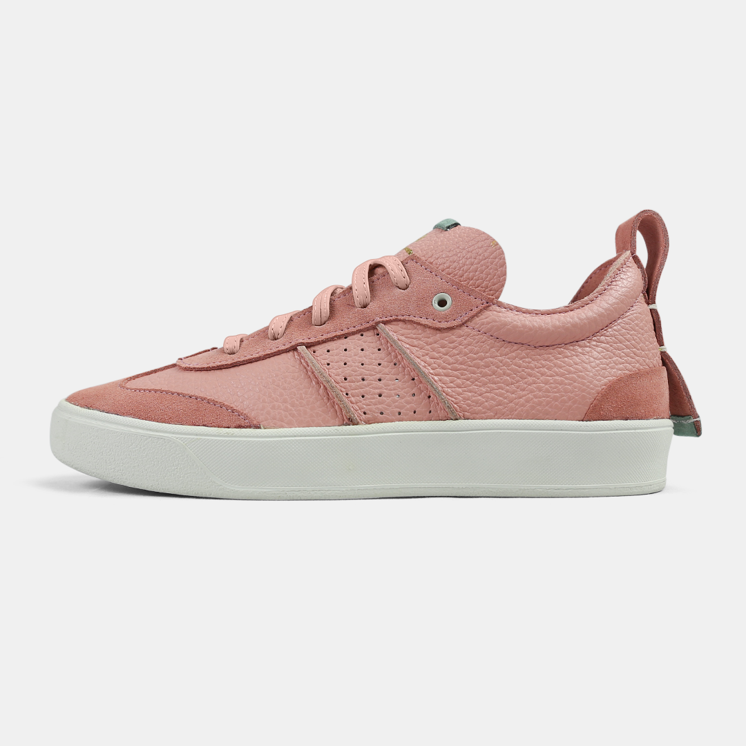 A pink men's sneaker with a lace-up closure, made from Italian leather, with a rubber cupsole lateral view
