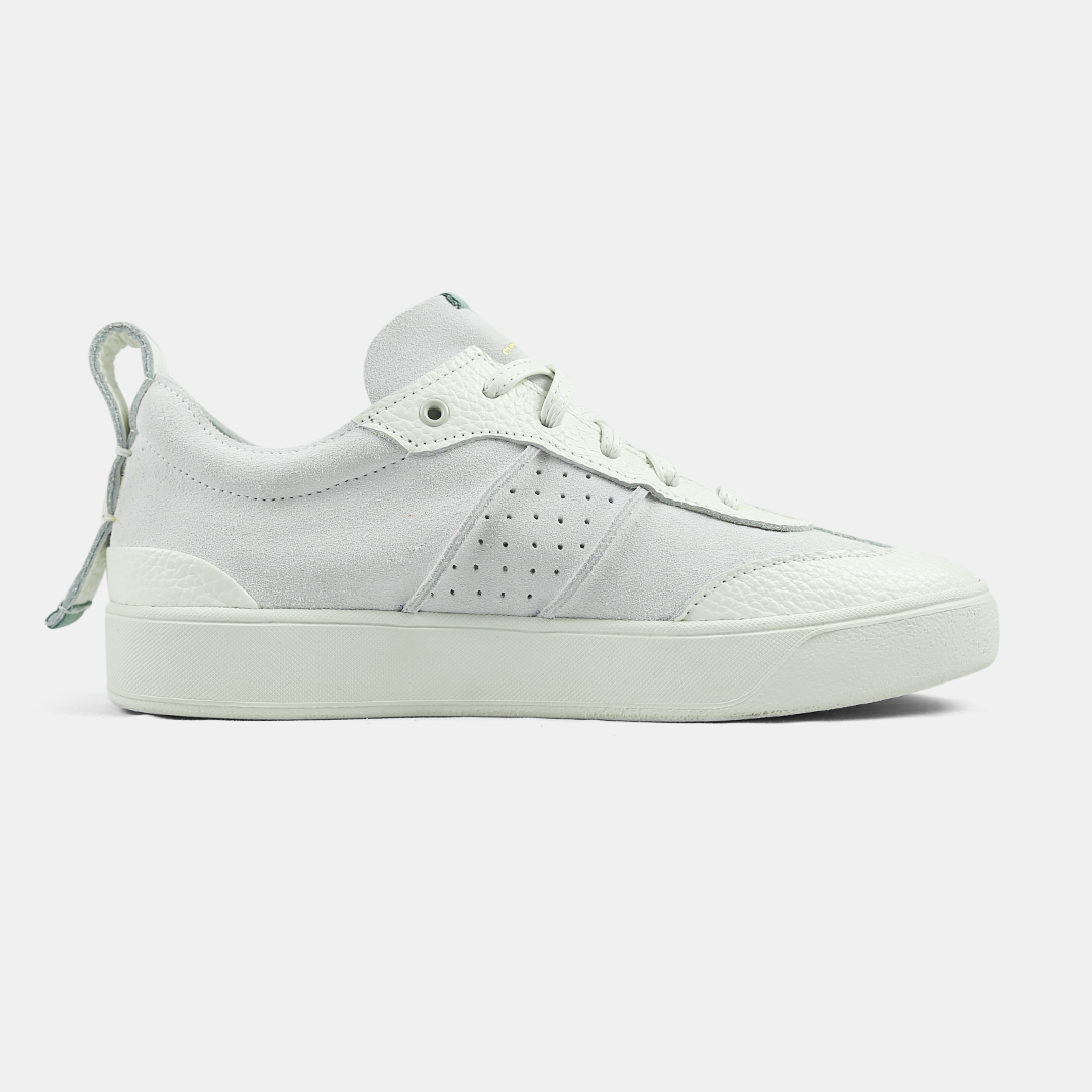 A white men's sneaker with a lace-up closure, made from Italian leather, with a rubber cupsole medial view