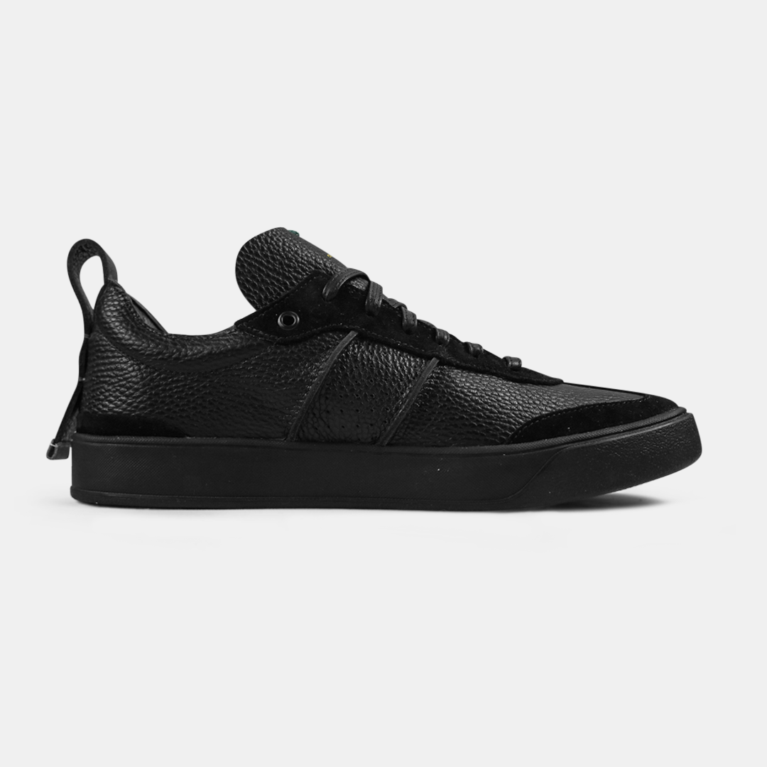 A black men's sneaker with a lace-up closure, made from Italian leather, with a rubber cupsole medial view