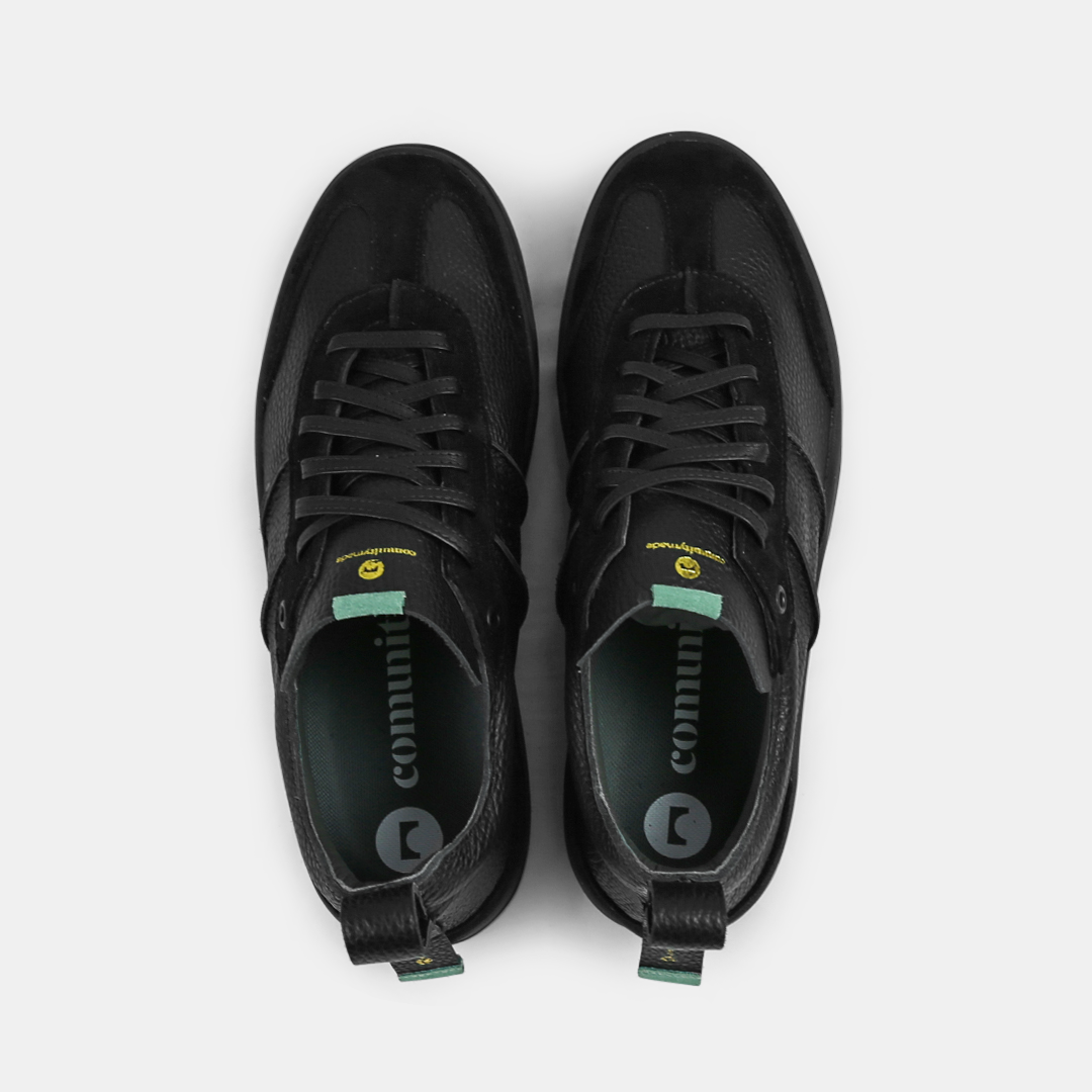 A black men's sneaker with a lace-up closure, made from Italian leather, with a rubber cupsole top view
