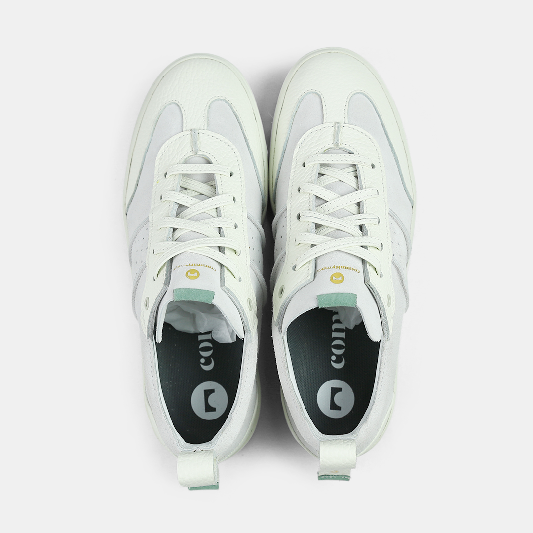 A white men's sneaker with a lace-up closure, made from Italian leather, with a rubber cupsole top view