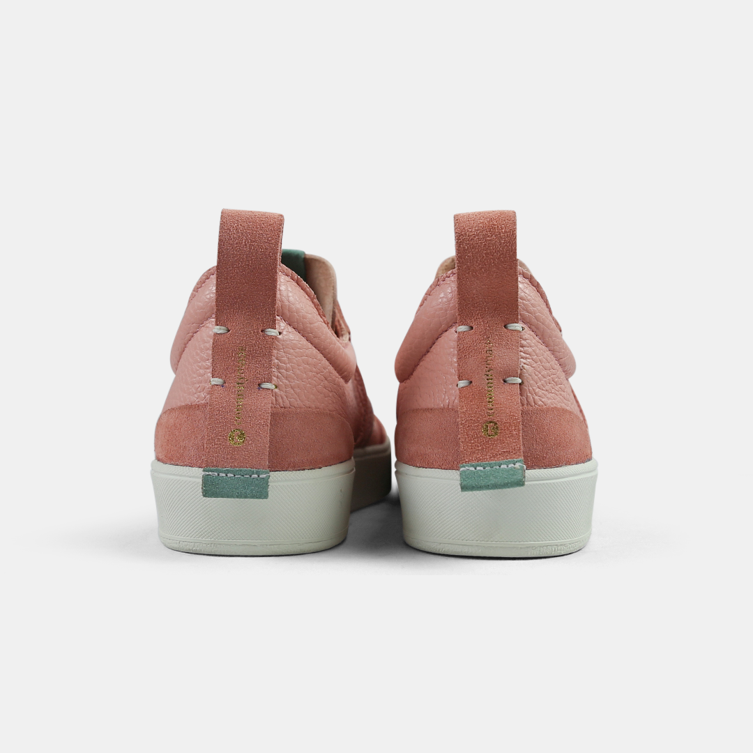 A pink men's sneaker with a lace-up closure, made from Italian leather, with a rubber cupsole back view