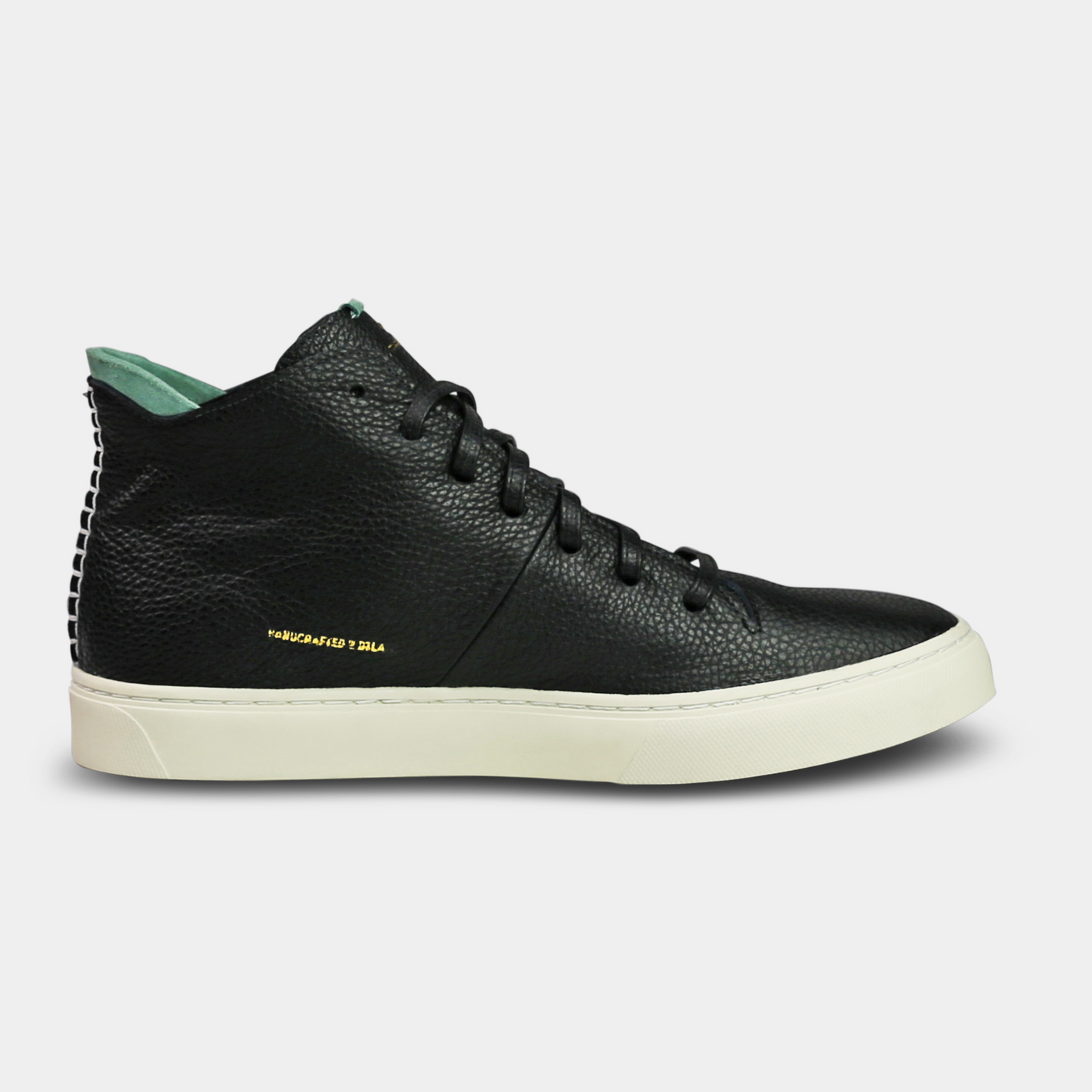 A black, mid-top sneaker with a leather upper, lace-up closure, and a white sole medial view