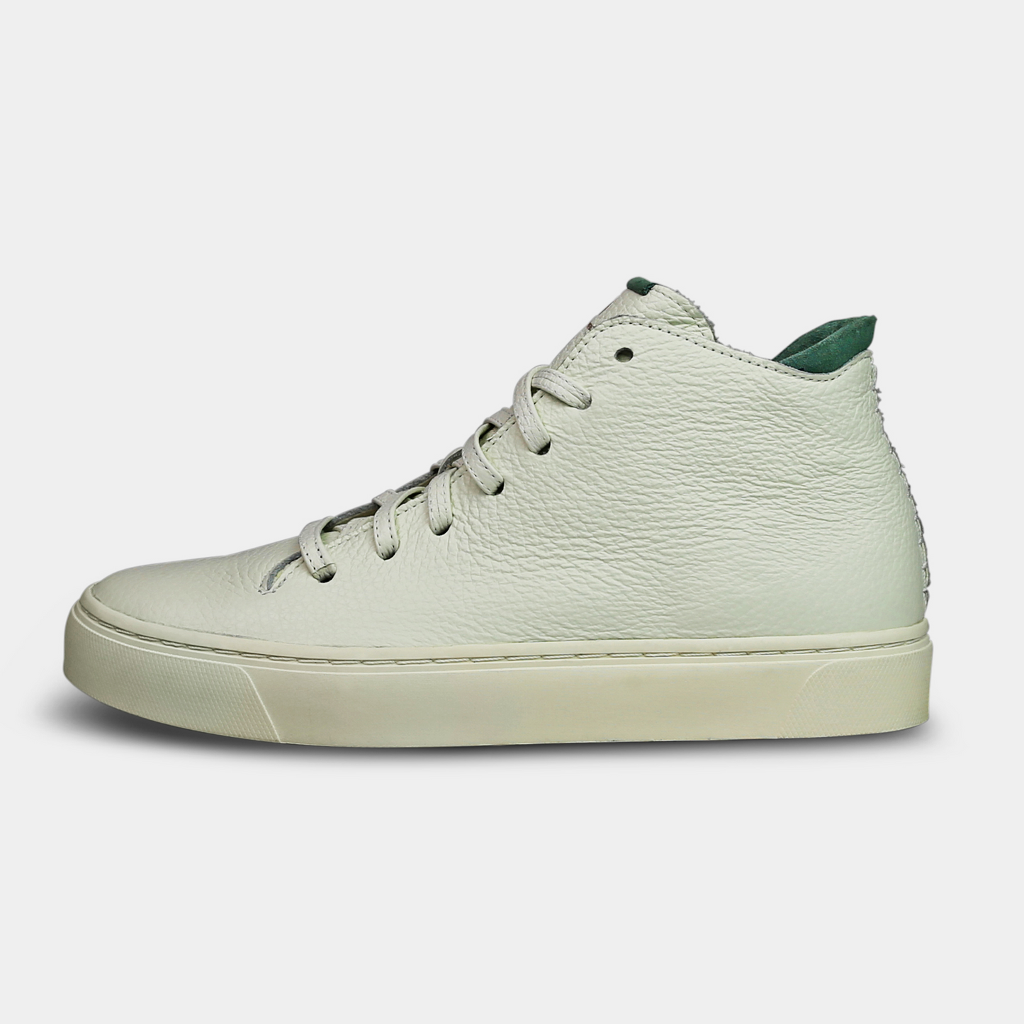 A white, mid-top sneaker with a leather upper, lace-up closure, and a white sole lateral view