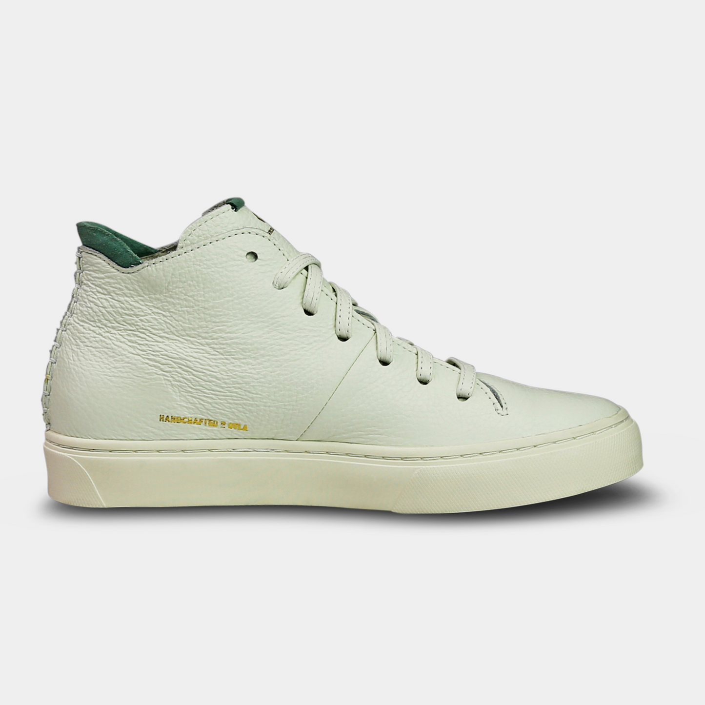 A white, mid-top sneaker with a leather upper, lace-up closure, and a white sole medial view