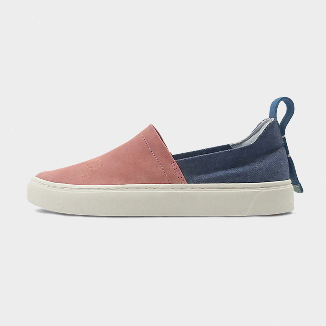 A pink and blue slip-on men's shoe with a suede and manmade material upper and a rubber sole lateral view