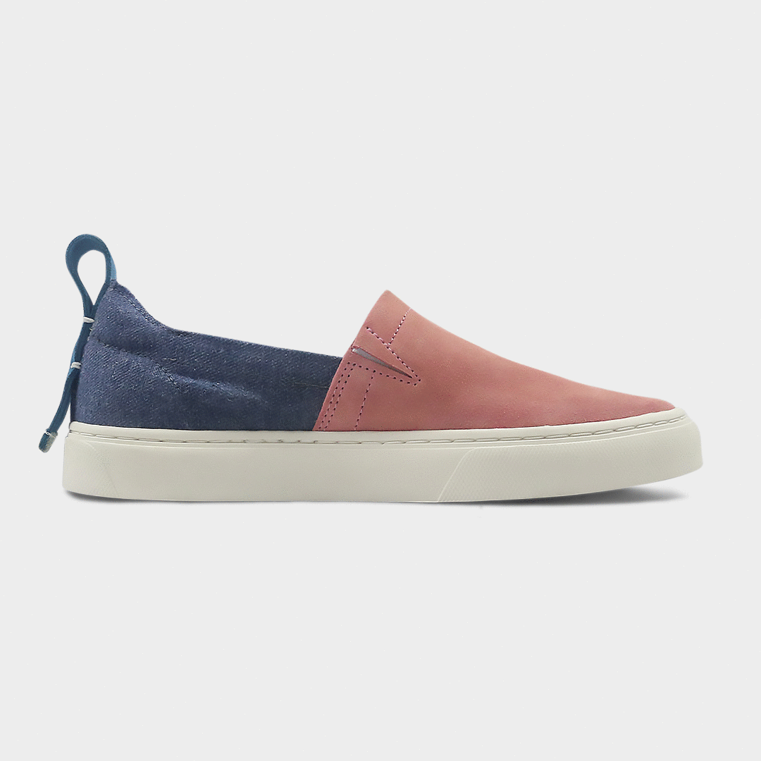 A pink and blue slip-on men's shoe with a suede and manmade material upper and a rubber sole medial view