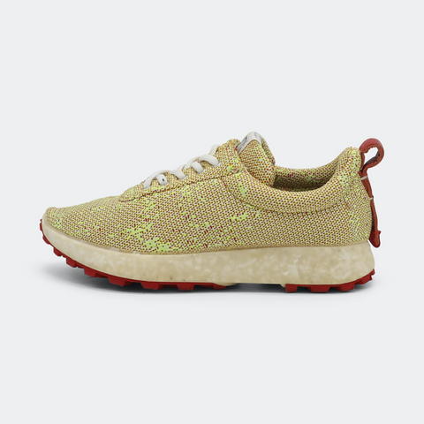 Yellow and pink patterned sneakers with a rubber outsole lateral view