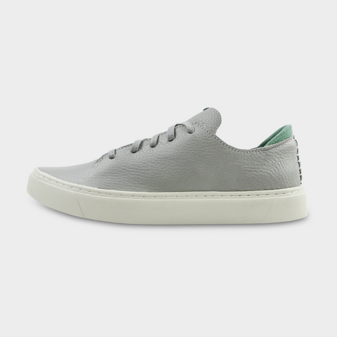 A gray men's sneaker with a lace-up closure made with Italian full grain leather, featuring a rubber cupsole lateral view